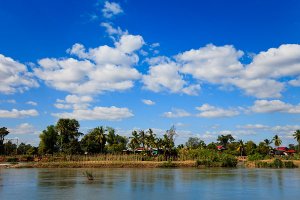 Guesthouses and restaurants on the banks of the Mekong River, located on Don Det Island which forms part of the Four Thousand Islands, known locally as Si Phan Don.
