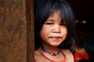 Portrait of a young girl from an animist Katu village, located in the Bolaven Plateau which was named after the Laven ethnic group which has historically dominated the region.