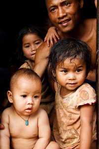 Portrait of a family from an animist Katu village, located in the Bolaven Plateau which was named after the Laven ethnic group which has historically dominated the region.