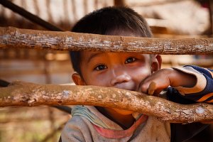 Portrait of a young boy from an animist Katu village, located in the Bolaven Plateau which was named after the Laven ethnic group which has historically dominated the region.