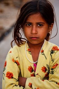 Portrait of a young girl during the annual Jaisalmer Desert Festival, a showcase of Rajasthani folk culture and arts.