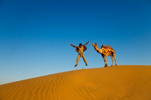 Dramatic scenery on a camel safari located 5km from Sam sand dunes during the annual Jaisalmer Desert Festival, a showcase of Rajasthani folk culture and arts.