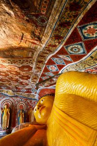 Reclining Buddha statue inside the second century B.C. Mulkirigala Raja Maha Viharaya, known locally as Little Sigiriya, located roughly 20km from Tangalle.