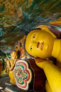 Reclining Buddha statue inside the second century B.C. Mulkirigala Raja Maha Viharaya, known locally as Little Sigiriya, located roughly 20km from Tangalle.