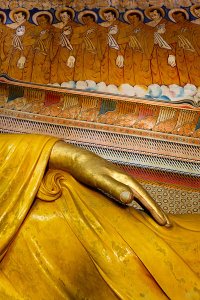 Detail of the large reclining Buddha statue inside the main image house of the late nineteenth century Wewurukannala Vihara Temple, located in the town of Dikwella.