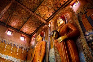 Large standing Buddha statues inside the main image house of the late nineteenth century Wewurukannala Vihara Temple, located in the town of Dikwella.